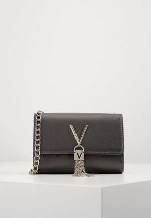 Black textured leather clutch with silver chain strap, silver "V" clasp, and silver tassel detail on a white surface.