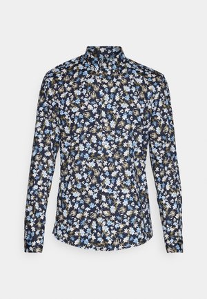 Bloemenoverhemd met een marineblauwe achtergrond, gekenmerkt door witte en blauwe bloemen, lange mouwen en een mandarinakraag.