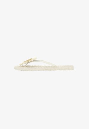 White braided flip-flop with flat sole, featuring a textured strap and a decorative flower accent.