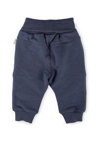 Marineblaue Jogginghosen aus weichem Stoff, mit einem elastischen Bund, gerippten Bündchen und gesteppten Details. Keine sichtbaren Taschen.