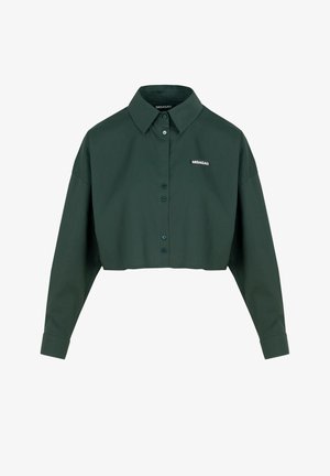 Kurzes, dunkelgrünes Hemd aus Baumwolle. Verfügt über einen spitzen Kragen, eine Knopfleiste und ein Logodetail auf der linken Brust. Lange Ärmel mit Manschetten.