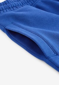 Next SLIM FIT CUFFED JOGGERS - Tepláky - light blue