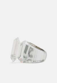 Clear acrylic ring with a geometric design, featuring a large, faceted top stone and a smooth, polished band.