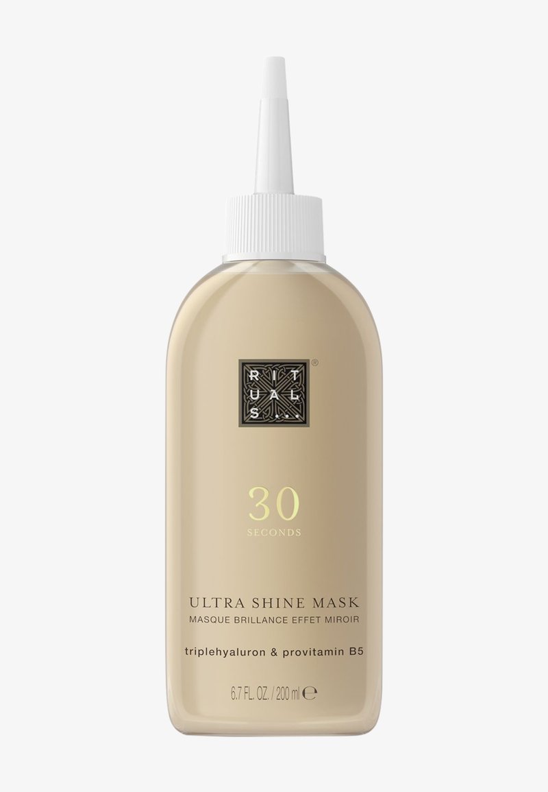 200 ml transparente Flasche von Ultra Shine Mask mit einem verjüngten Ausguss, beige Farbe, schwarz-goldene Etikettendetails und einem strukturierten weißen Deckel.