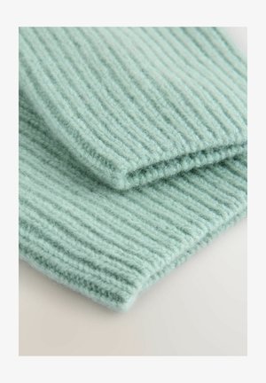 Blødt, mintgrønt strikket stof med ribbestruktur, synlige fibre og en glat kant. To sektioner lagdelt oven på hinanden.