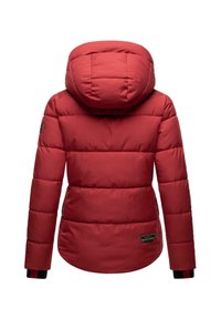 Red padded jacket with a hood, featuring a quilted design and black striped cuffs. Includes a brand label on the lower left side.