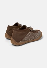 Brown athletic shoes with a textured upper and a rubber sole, featuring lace-up design and a smooth finish on the back side.