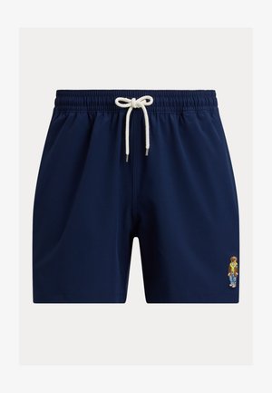 Calções de banho azul-marinho feitos de tecido suave, apresentando uma cintura elástica com um cordão branco e um pequeno design de urso bordado.