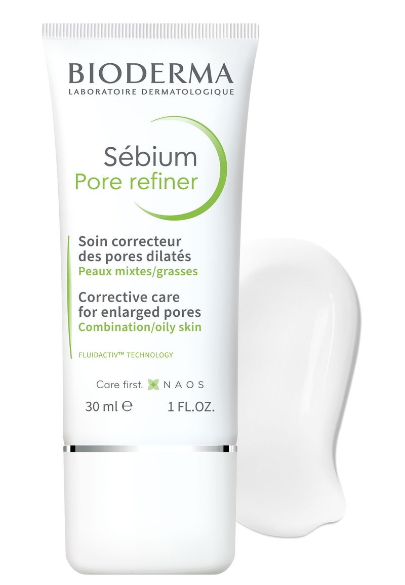 Bioderma Sébium Pore Refiner, tube de 30 ml avec un corps blanc, des accents verts et une base argentée ; comprend un petit blob de crème blanche à côté.
