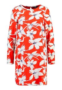 Robe rouge à manches longues, motif floral blanc. Fabriquée en tissu doux, elle présente un col rond et une coupe ample.