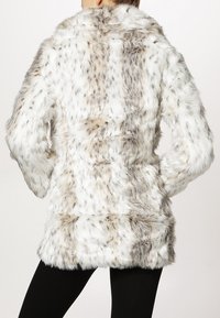 Faux fur coat in white and gray with a textured, plush surface. Features a shawl collar and loose fit. No visible fastenings.