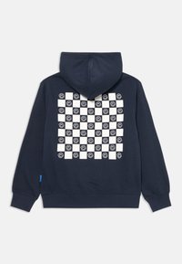Sudadera marinera con un patrón de tablero de ajedrez en la parte trasera, con cuadros blancos y diseños de caras sonrientes negras. Fabricada con tejido robótico y con un bolsillo frontal.
