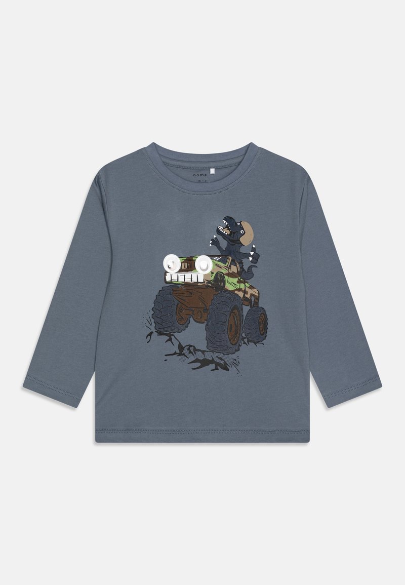 Long-sleeve grey cotton t-shirt featuring a graphic of a monster truck and a character with exaggerated eyes, set against a light background.