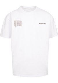 White cotton t-shirt with short sleeves. Front features "BIRD OF PEACE" in bold, stylized text and "MERCHC•DE" in smaller letters.
