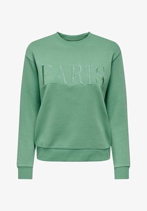 Green crewneck sweatshirt with ribbed cuffs and hem, featuring large embroidered "PARIS" text across the chest.