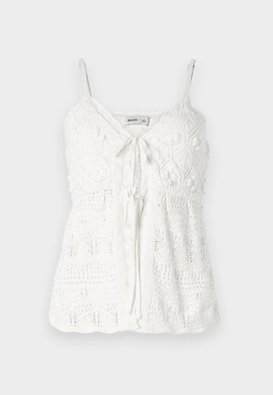 Valge heegeldatud topp reguleeritavate õhukeste rihmadega, laineline kaelus ja sidumise ees. Omab keerukaid mustreid ja tekstuurseid pallikesi aktsentidena.