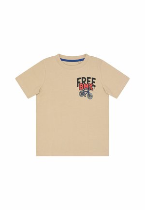 T-shirt beige à manches courtes pour enfant avec le texte « FREE BMX » et un dessin d’un vélo BMX bleu sur le haut gauche de la poitrine.