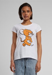 Witte katoenen T-shirt met een cartoonfiguur in het oranje. Korte mouwen, ronde hals, met een speelse print aan de voorkant.