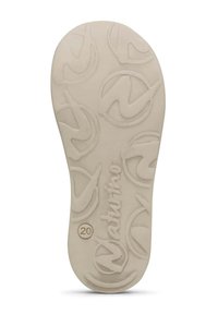 Soletta per scarpe beige con un motivo testurizzato, caratterizzata da loghi circolari e un numero "20" in rilievo. Superficie liscia con lievi contorni.