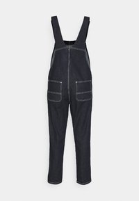 Dark blue denim overalls with wide straps, a front zipper, and two large front pockets. White stitching and tapered leg design.