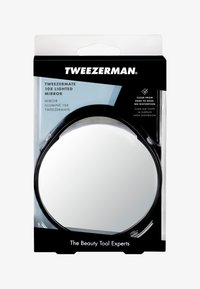 Miroir grossissant rond éclairé Tweezerman Tweezermate 10x dans un emballage noir, étiquette claire d'un bord à l'autre, sans distorsion.