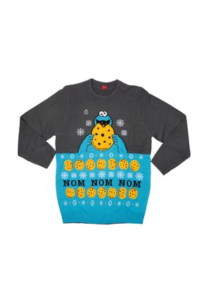 Gray sweater featuring a blue Cookie Monster graphic, cookies, and "NOM NOM NOM" text. Snowflake patterns decorate the upper section.