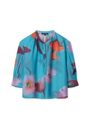 Light blue blouse featuring a floral pattern in red, orange, and purple, with a front keyhole opening and gathered sleeves. Smooth fabric.