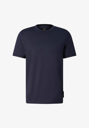 T-shirt uni bleu marine à manches courtes et col rond, tissu lisse, avec un logo discret sur la manche gauche et une étiquette sur la couture latérale inférieure.
