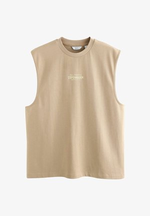 Világos bézs ujjatlan top puha pamutból, kerek nyakkivágással, elöl „COPENHAGEN” világos felirattal. Egyszerű, laza dizájn.