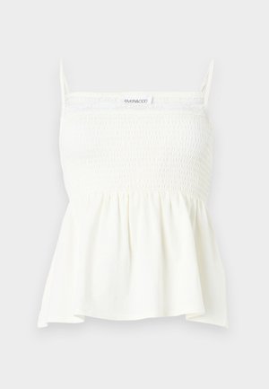 Λευκό αμάνικο τοπ με σμηκωμένο μπούστο, λεπτές τιράντες και τελείωμα πεπλούμ, σχεδιασμένο για άνετη εφαρμογή.