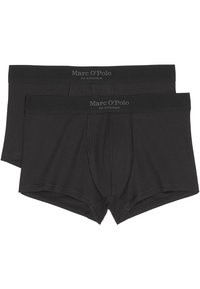 Svarta bomullsnattkjolar med ribbad textur, med ett brett midjeband där "Marc O’Polo" och "EST. I STOCKHOLM" är tryckt i grått.