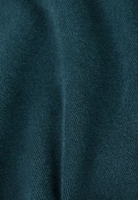 Dark teal soft fabric with a looped terry texture, shown in gentle folds highlighting its thickness and plush surface.