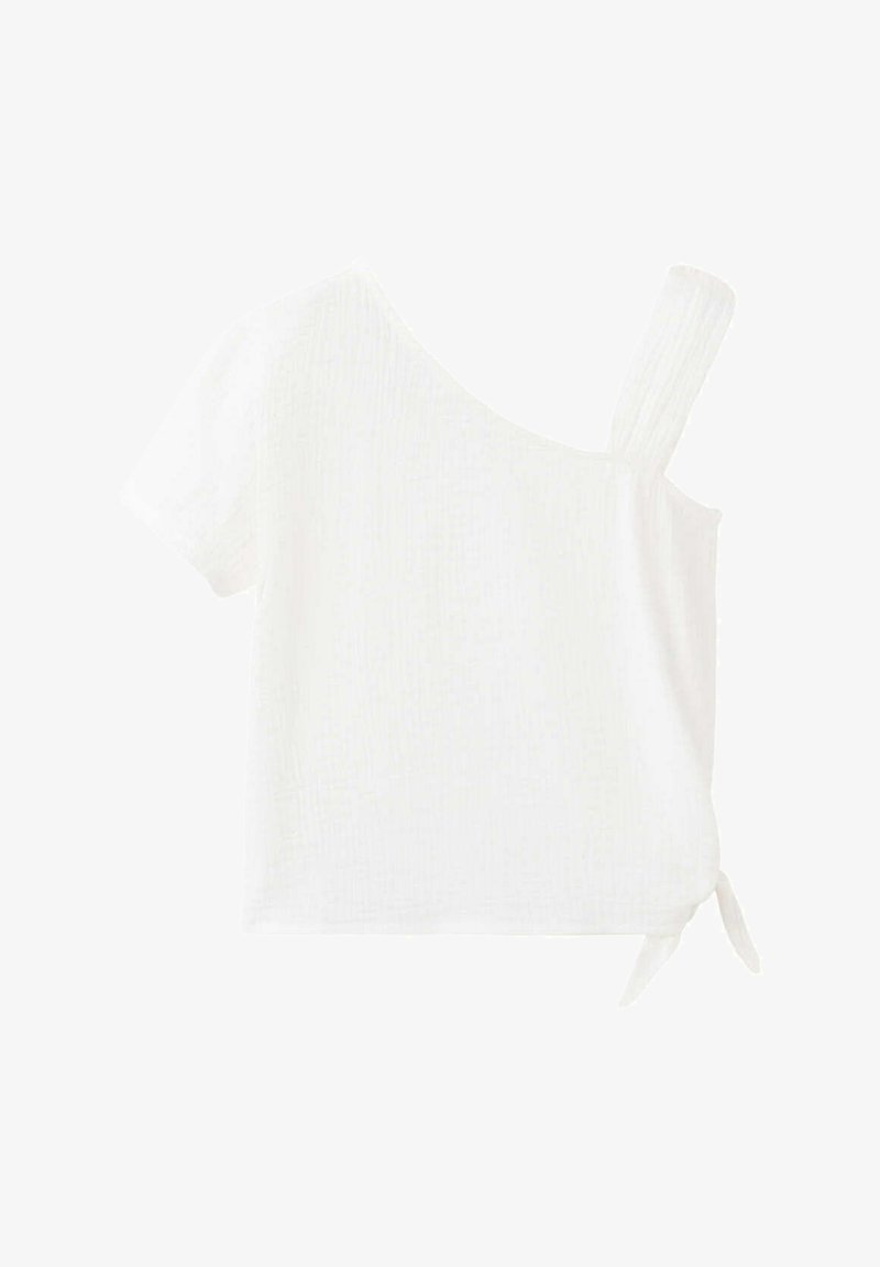 Haut blanc à manches courtes avec une large bretelle et un décolleté asymétrique, avec un petit nœud latéral à l'ourlet.