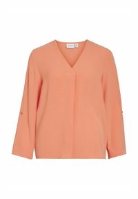 Blusa color pescozzo con scollatura a V, maniche lunghe e vestibilità ampia. Presenta una sottile trama e dettagli con bottoni sulle maniche.