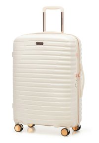 Hard-shell white suitcase with four gold-accented wheels, retractable handle, side handle, and zipper with integrated lock.