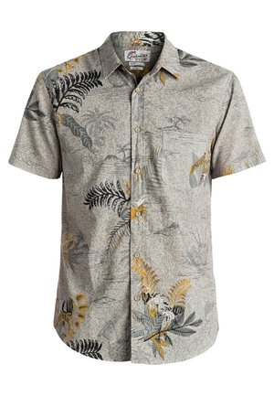 Chemise beige à manches courtes avec boutons, motifs de feuilles tropicales et de fleurs en noir, jaune et gris, avec une poche poitrine.