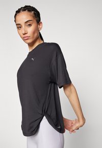 Puma STUDIO TWIST TEE  - Sportfelső - black