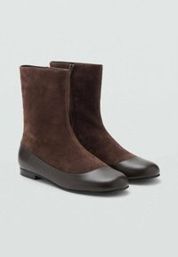 Brown suede ankle boots with a smooth dark brown leather toe cap and heel. Features a side zipper and flat sole.