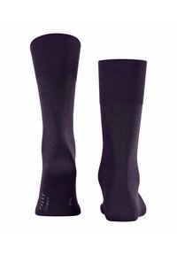 Calzini viola con polsini a coste, texture liscia e branding sottile. Il design presenta una costruzione senza cuciture per comfort e vestibilità.