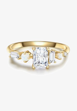 Kuldne sõrmus, mille keskel asub suur ristkülikukujuline selge kivi, mille külgedel on väiksemad ristkülikukujulised ja ümmargused opaalset kivid, millel on poleeritud pind.