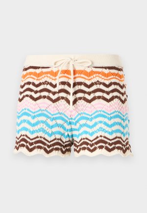 Knit shorts featuring a wave pattern in shades of orange, brown, pink, and blue, with a cream waistband and a drawstring. Scalloped hem.