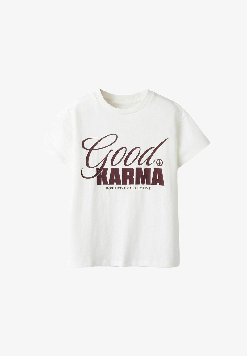 T-shirt en coton blanc avec un texte imprimé en marron portant les mots « Good KARMA » et « POSITIVIST COLLECTIVE », accompagné d'un symbole de paix.