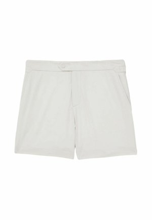 Heledad beezhikil lühikesed püksid pehmest kangast, nupupane ja küljetaskudega, millel on õmmeldud detailid vöökoha ääres.