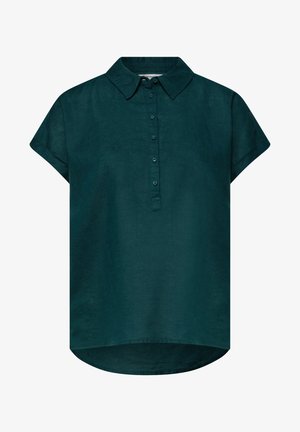 Blouse vert foncé à manches courtes avec col et patte de boutonnage sur le devant, ourlet arrière légèrement plus long, texture de tissu uni.