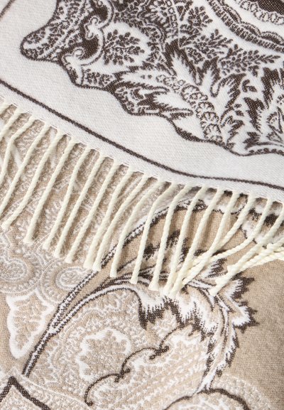Écharpe en laine avec motifs cachemire beige et marron et franges torsadées de couleur crème le long d'un bord.