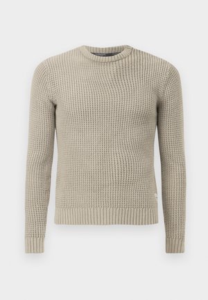Suéter de punto beige con mangas largas, puño y dobladillo acanalados, cuello redondo, patrón texturizado, hecho de material suave.