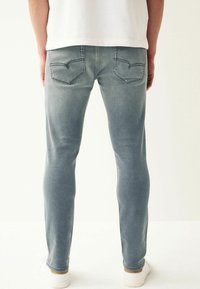 Next SUPER STRETCH COMFORT - Traperice ravnih nogavica - light blue