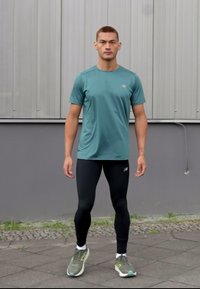 New Balance SLEEK REFLECIVE TIGHT - Leggings - black