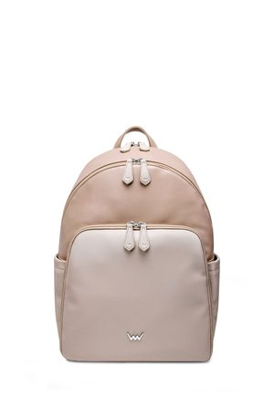 Pale pink leather backpack with a rounded design, dual zip closures, front pocket, and logo detail at the bottom. Smooth texture.
