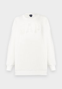 Felpa in pile bianca con polsini e orlo a coste, con un grande logo "GAP" impresso in rilievo di colore chiaro sulla parte anteriore.